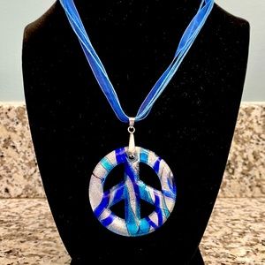 Blue glass peace sign